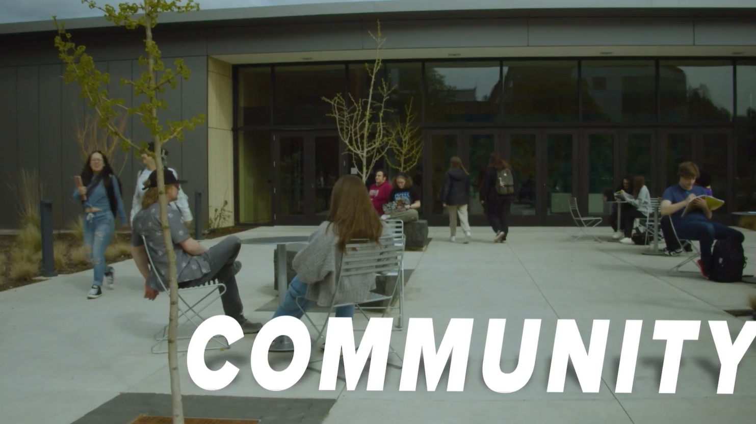 A shot of the Life Science Building with a 3D text box labeled COMMUNITY.